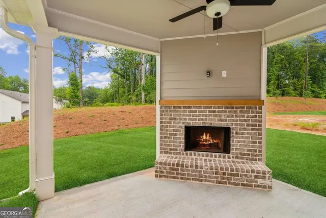 a view of an empty room with a fireplace