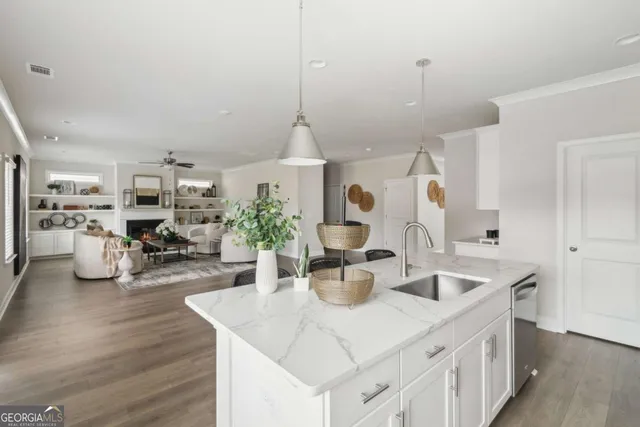 a kitchen with sink and refrigerator