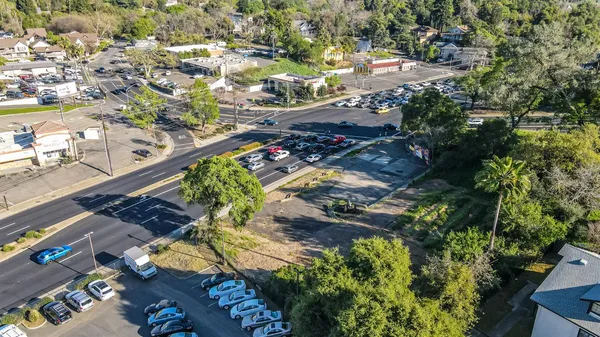 an aerial view of residential houses with outdoor space