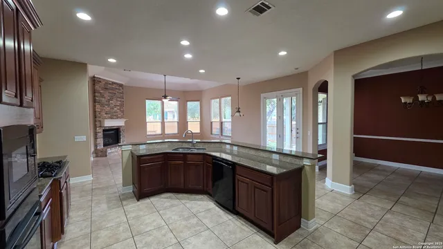 a kitchen with a sink and stove