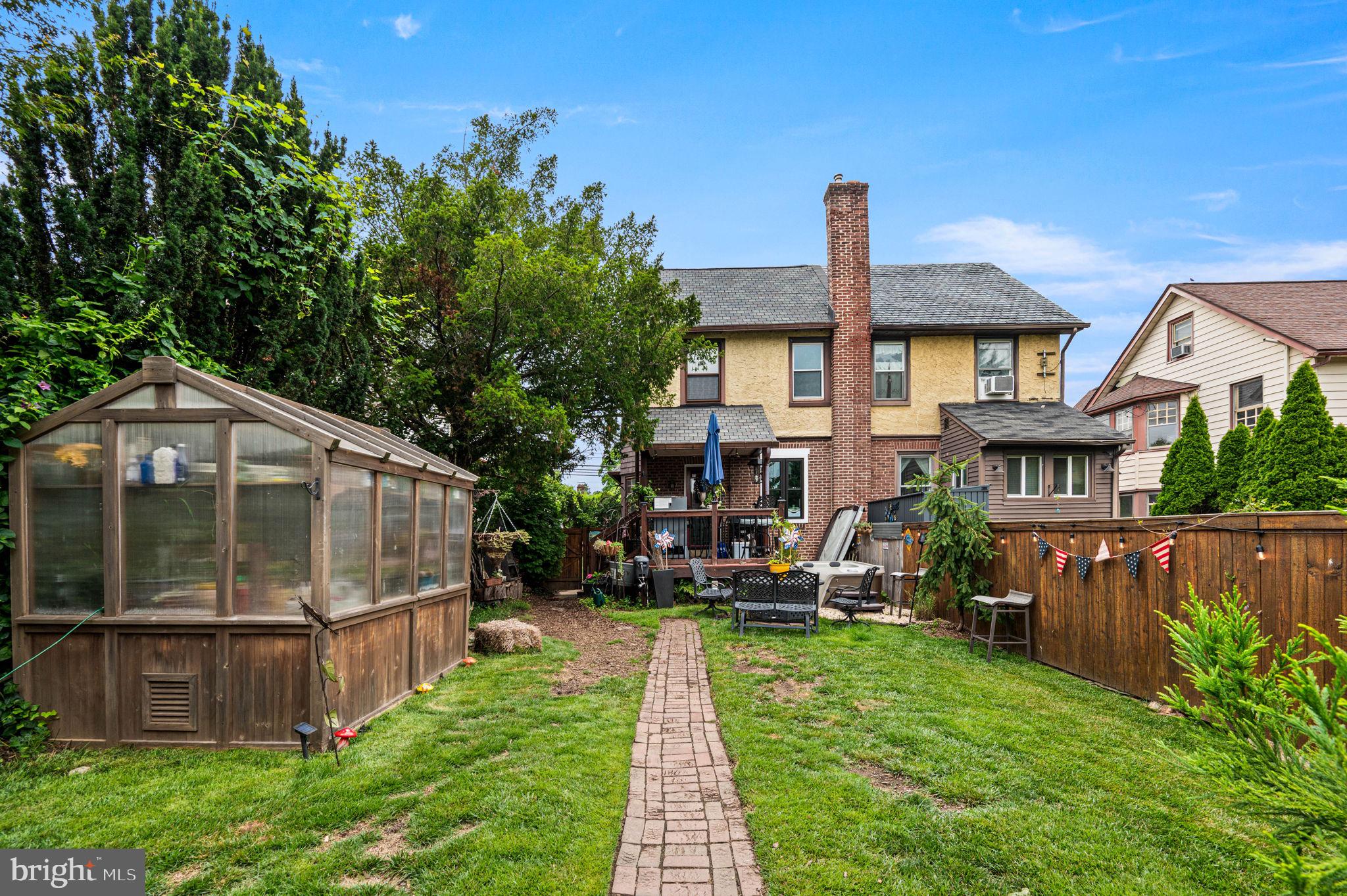 3 Township Line Road Elkins Park, PA 19027 - Photo 40 of 40 Charming backyard oasis with greenery.