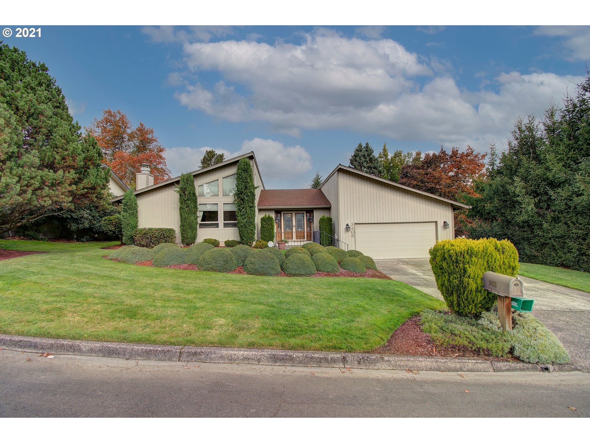3408 Northeast 161st Street Ridgefield, WA 98642 - Photo 1 of 29 a front view of a house with garden