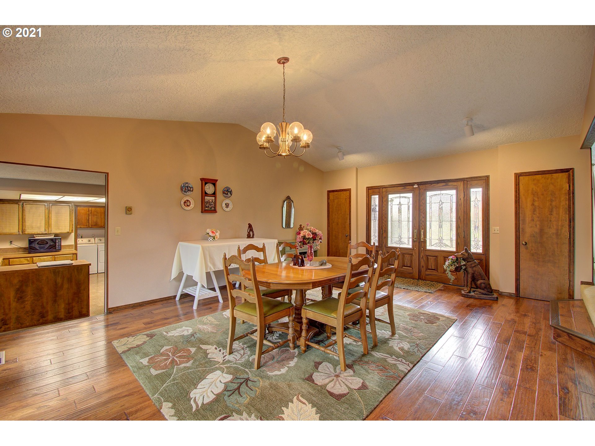 3408 Northeast 161st Street Ridgefield, WA 98642 - Photo 5 of 29 a view of a dining room with furniture and wooden floor