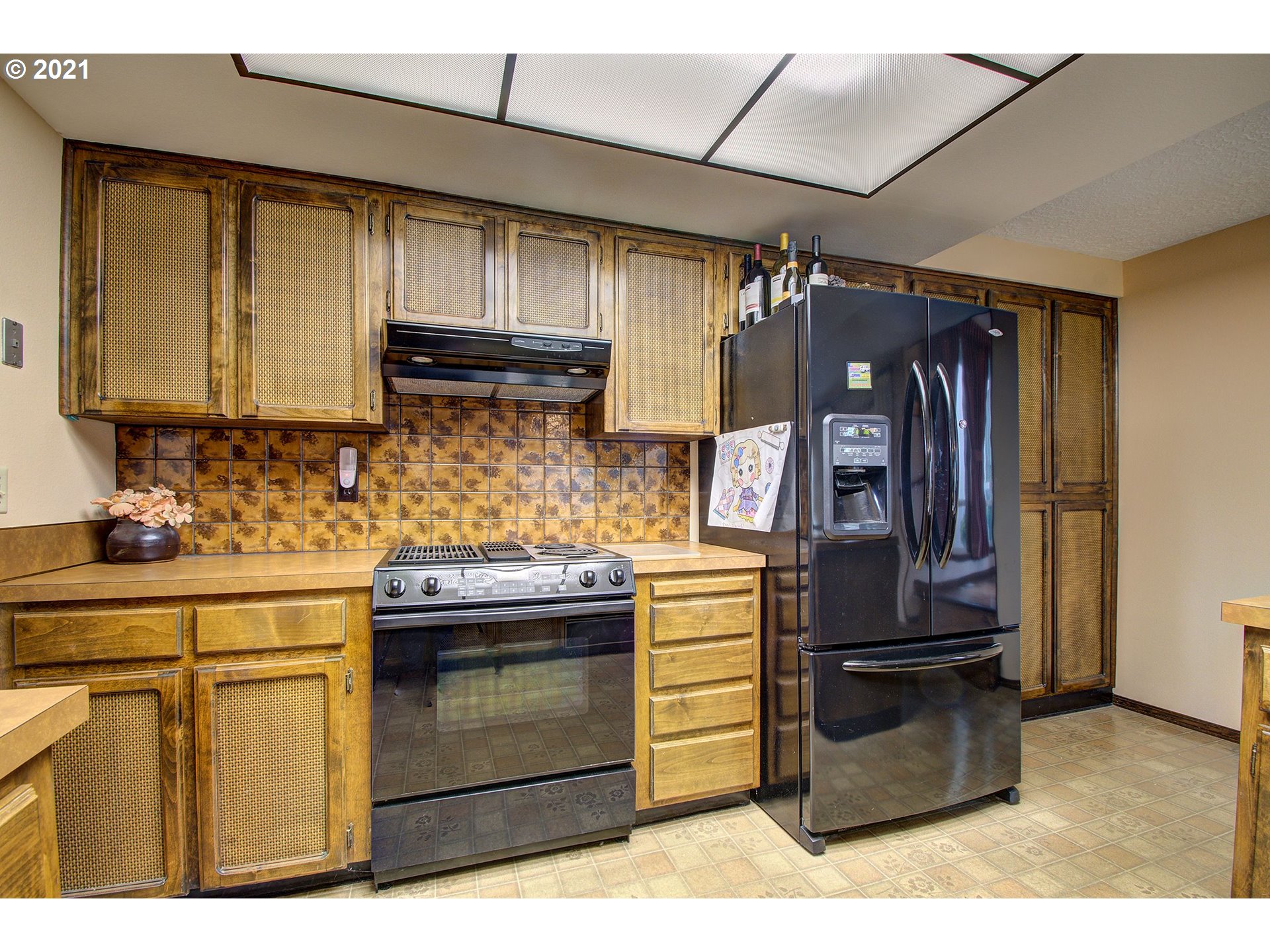 3408 Northeast 161st Street Ridgefield, WA 98642 - Photo 7 of 29 a kitchen with stainless steel appliances granite countertop a sink and a stove