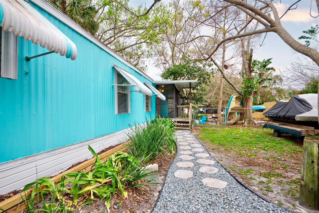 6427 West Richard Drive Weeki Wachee, FL 34607 - Photo 4 of 35 a backyard of a house with outdoor seating