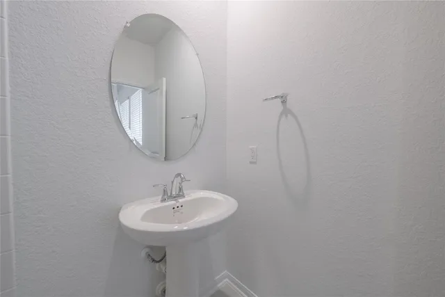 a view of a swimming pool and lounge chairs