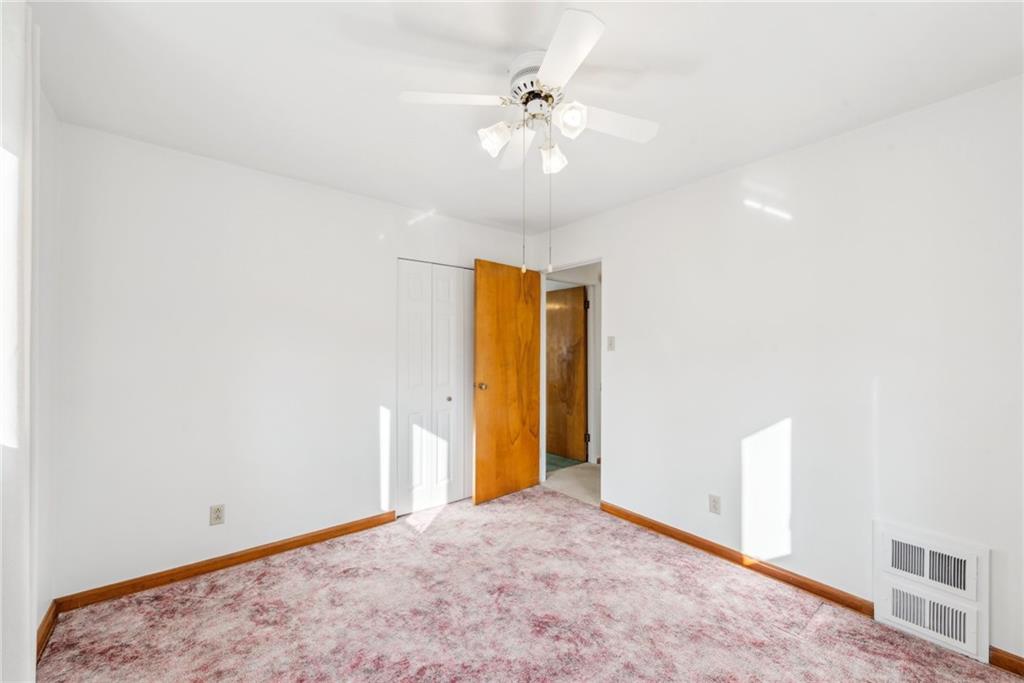 614 Maple Street Jeannette, PA 15644 - Photo 16 of 26 a view of an empty room with a chandelier fan