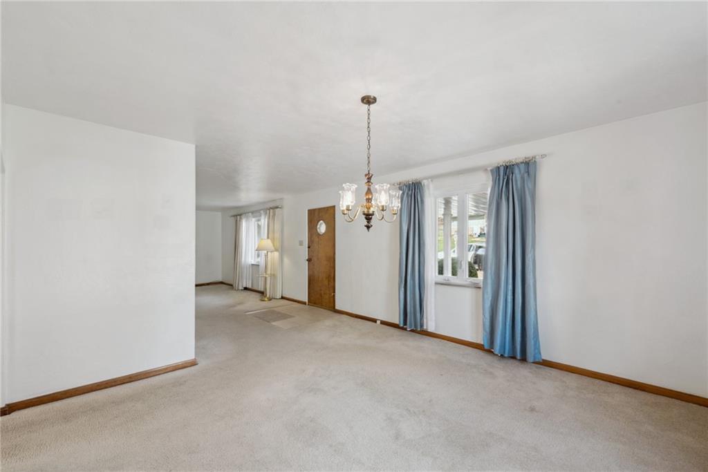 614 Maple Street Jeannette, PA 15644 - Photo 5 of 26 a view of a room with windows and refrigerator