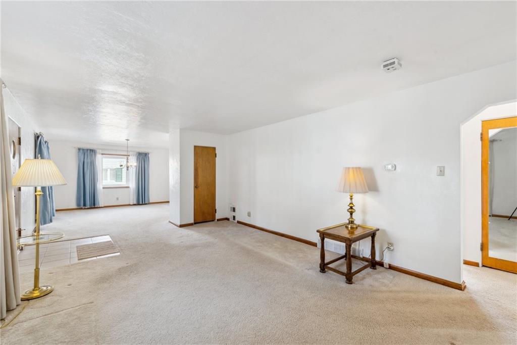 614 Maple Street Jeannette, PA 15644 - Photo 8 of 26 a view of a livingroom with furniture and a lamp