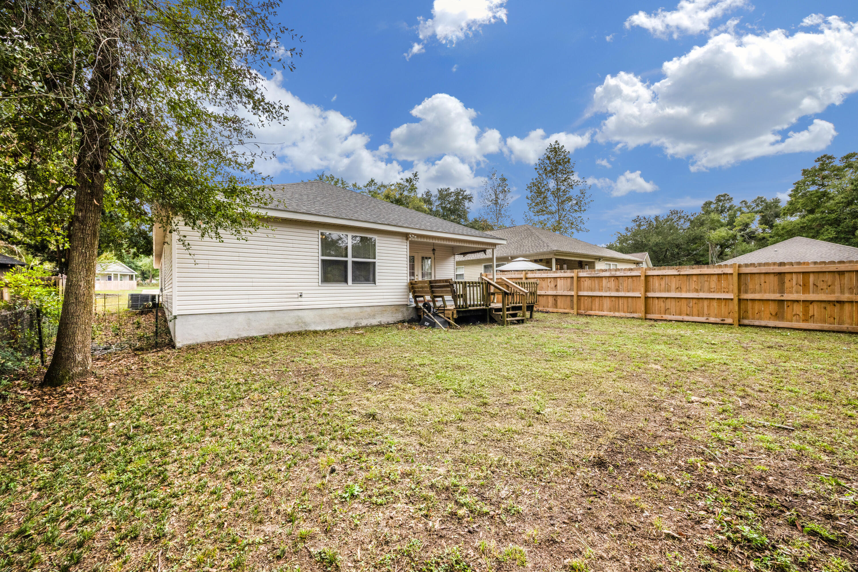203 8th Avenue Crestview, FL 32536 - Photo 16 of 17 a view of a house with a backyard