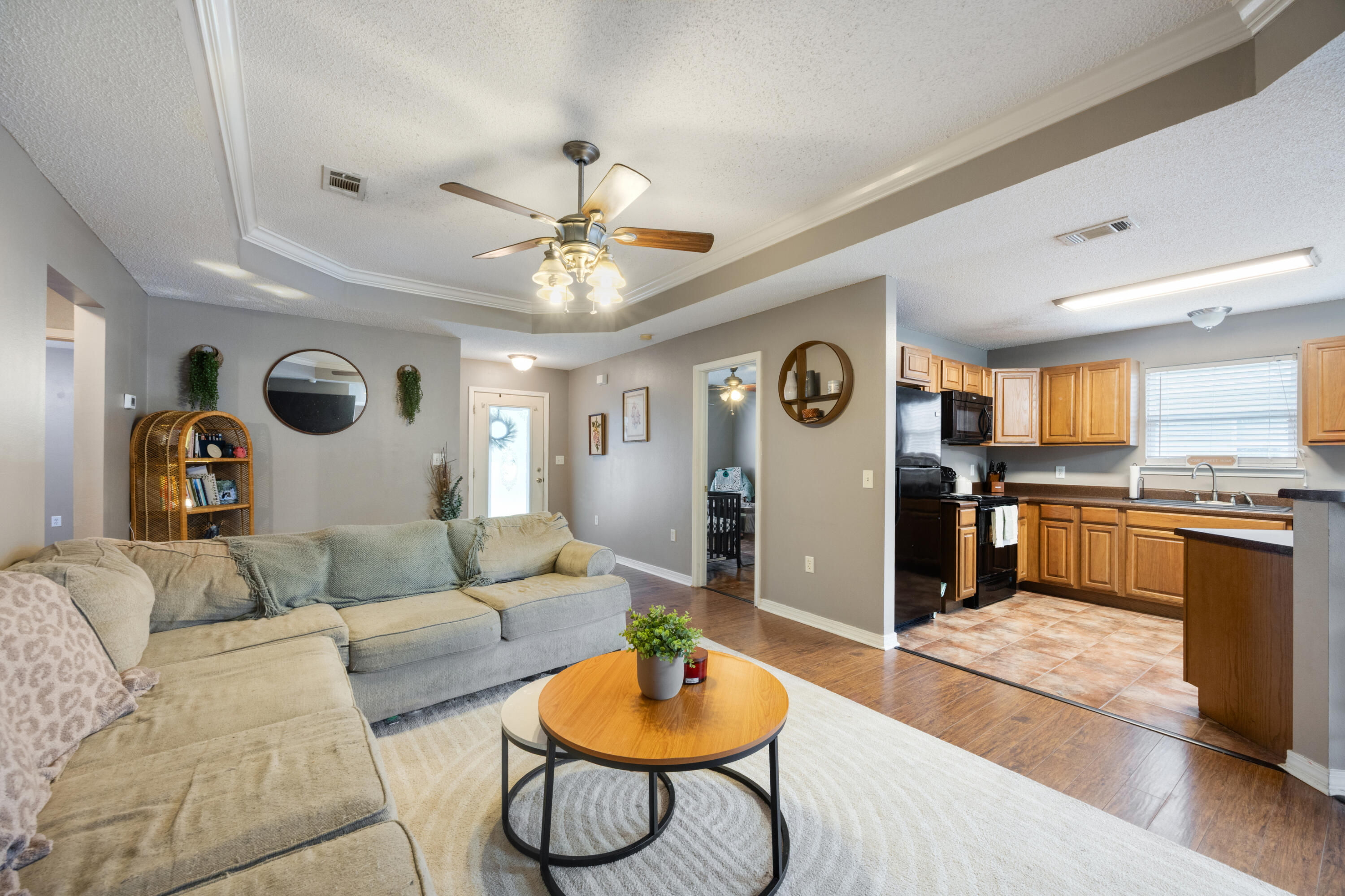 203 8th Avenue Crestview, FL 32536 - Photo 4 of 17 a living room with furniture and kitchen view