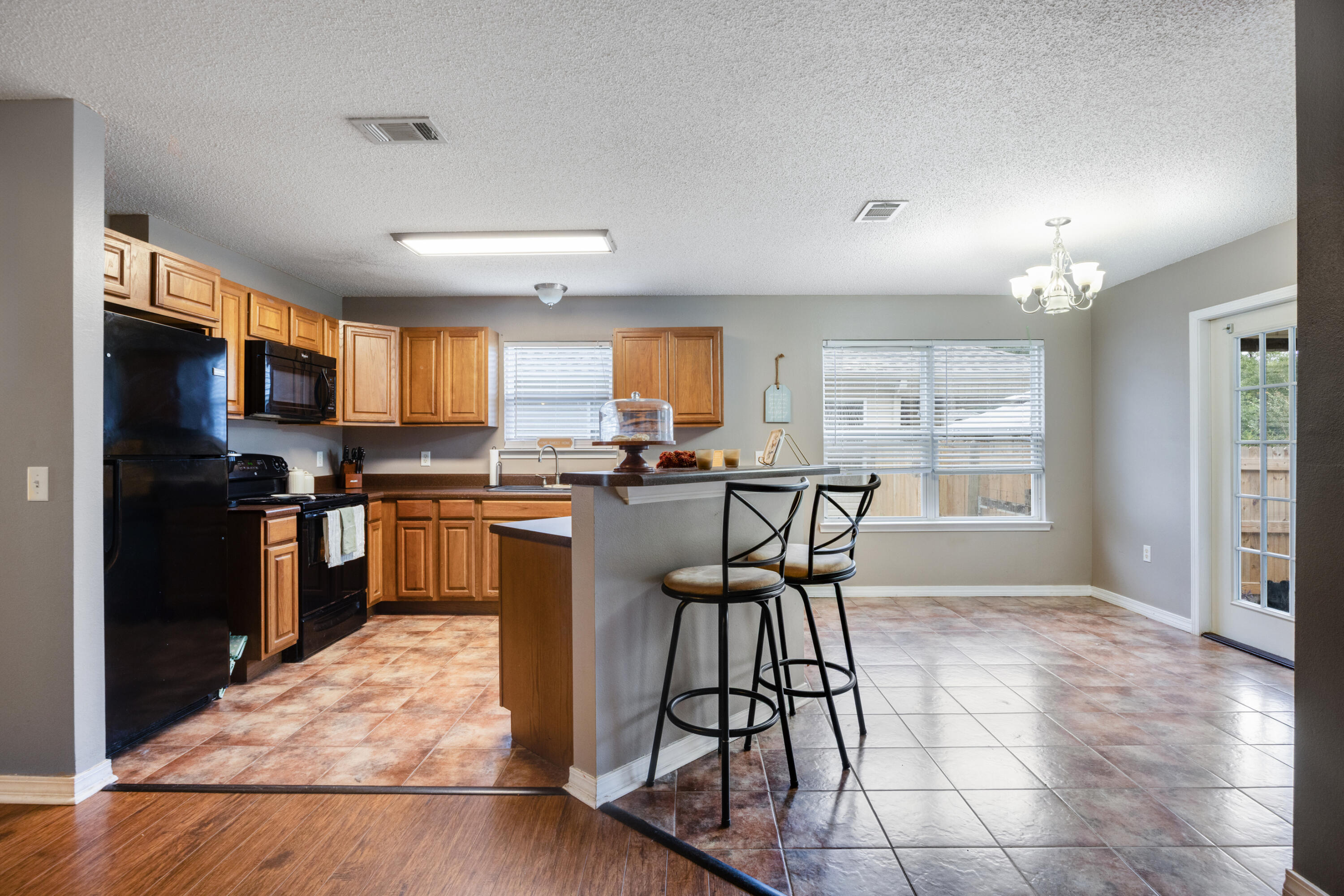 203 8th Avenue Crestview, FL 32536 - Photo 10 of 17 a kitchen with granite countertop a counter space a sink appliances and cabinets