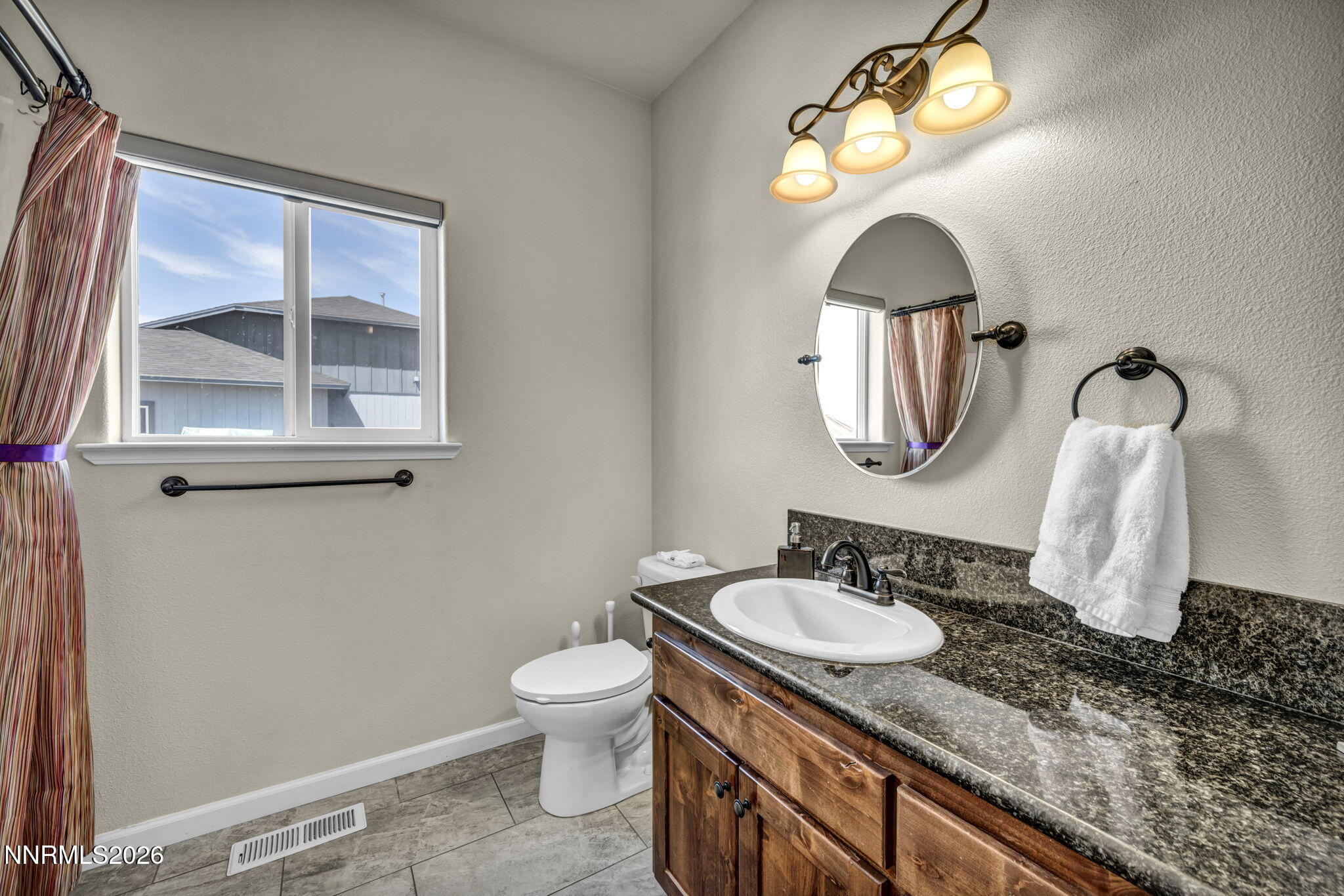 1286 Sky Ridge Drive Fallon, NV 89406 - Photo 31 of 49 a bathroom with a granite countertop sink and a mirror
