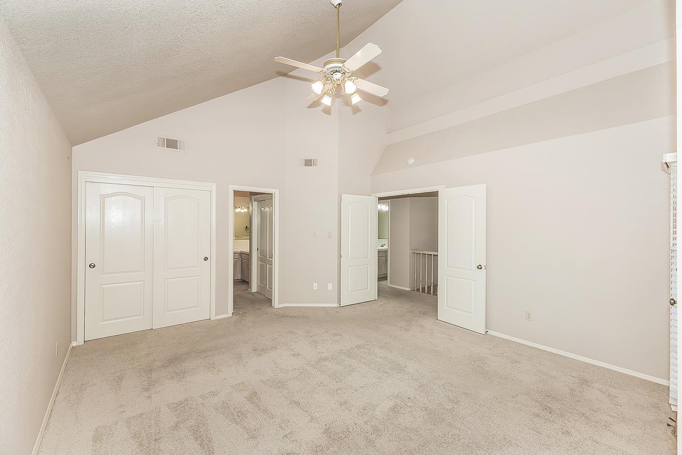 1282 West Flora Avenue Reedley, CA 93654 - Photo 18 of 49 a view of an empty room with a chandelier fan