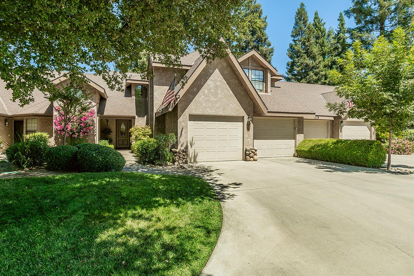 1282 West Flora Avenue Reedley, CA 93654 - Photo 2 of 49 a view of house with yard and green space