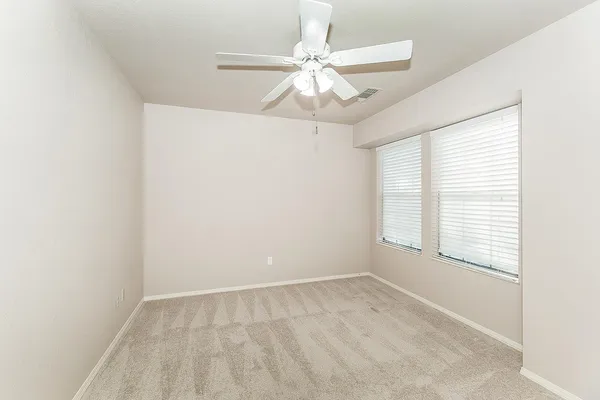 a view of work space with furniture fireplace and windows