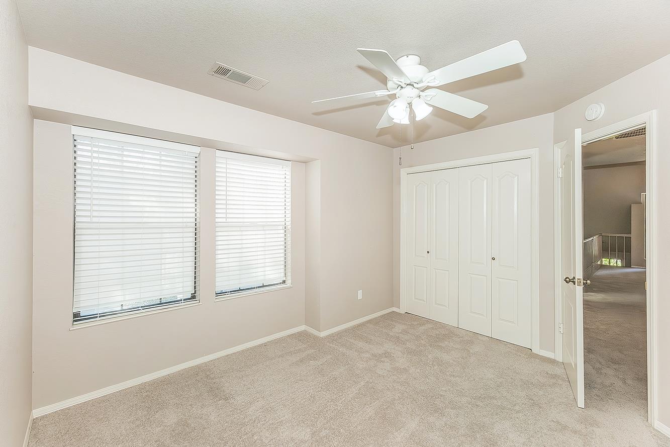 1282 West Flora Avenue Reedley, CA 93654 - Photo 29 of 49 a view of an empty room with closet and a window