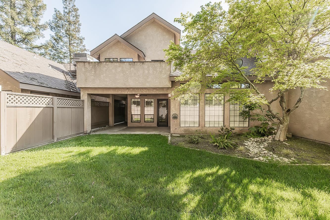 1282 West Flora Avenue Reedley, CA 93654 - Photo 44 of 49 a view of an house with backyard and garden