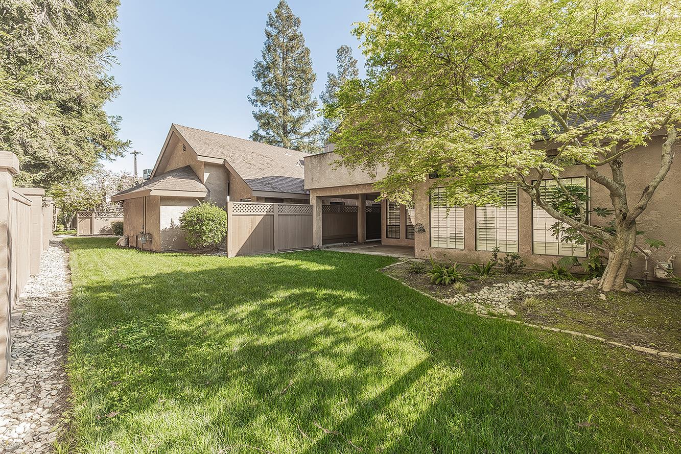 1282 West Flora Avenue Reedley, CA 93654 - Photo 45 of 49 a front view of a house with a garden