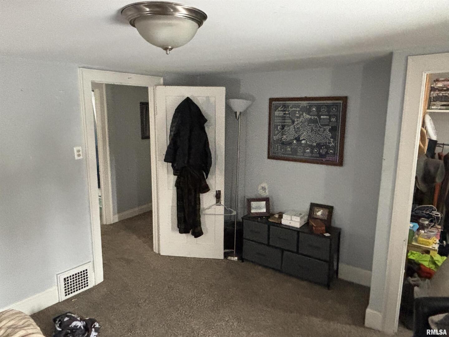 2225 Pershing Boulevard Clinton, IA 52732 - Photo 6 of 7 a view of a livingroom with furniture and hallway