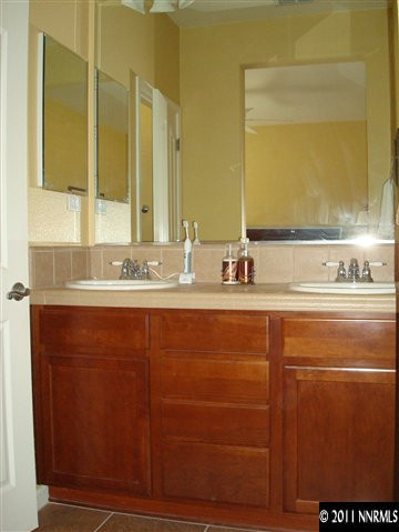501 Martingale Court Reno, NV 89521 - Photo 11 of 13 a bathroom with a sink and a mirror