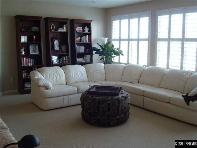 501 Martingale Court Reno, NV 89521 - Photo 2 of 13 a living room with furniture and a large window