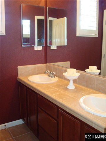 501 Martingale Court Reno, NV 89521 - Photo 9 of 13 a bathroom with a sink and a mirror