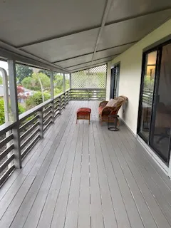 a balcony with wooden floor