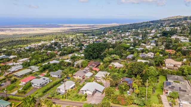 an aerial view of residential building and green space