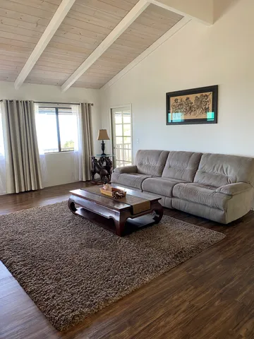 a living room with furniture and a rug