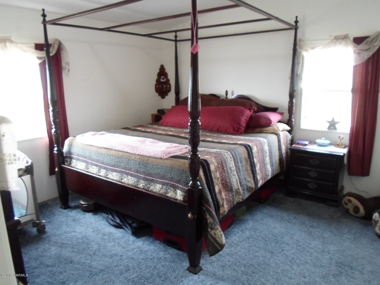 11533 Mieras Road Yakima, WA 98901 - Photo 8 of 37 a bed sitting in a bedroom next to a window