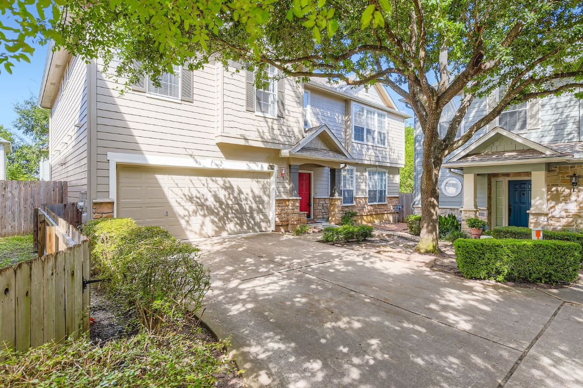 8518 Cahill Drive, Unit 20 Austin, TX 78729 - Photo 2 of 36 a front view of a house with garden