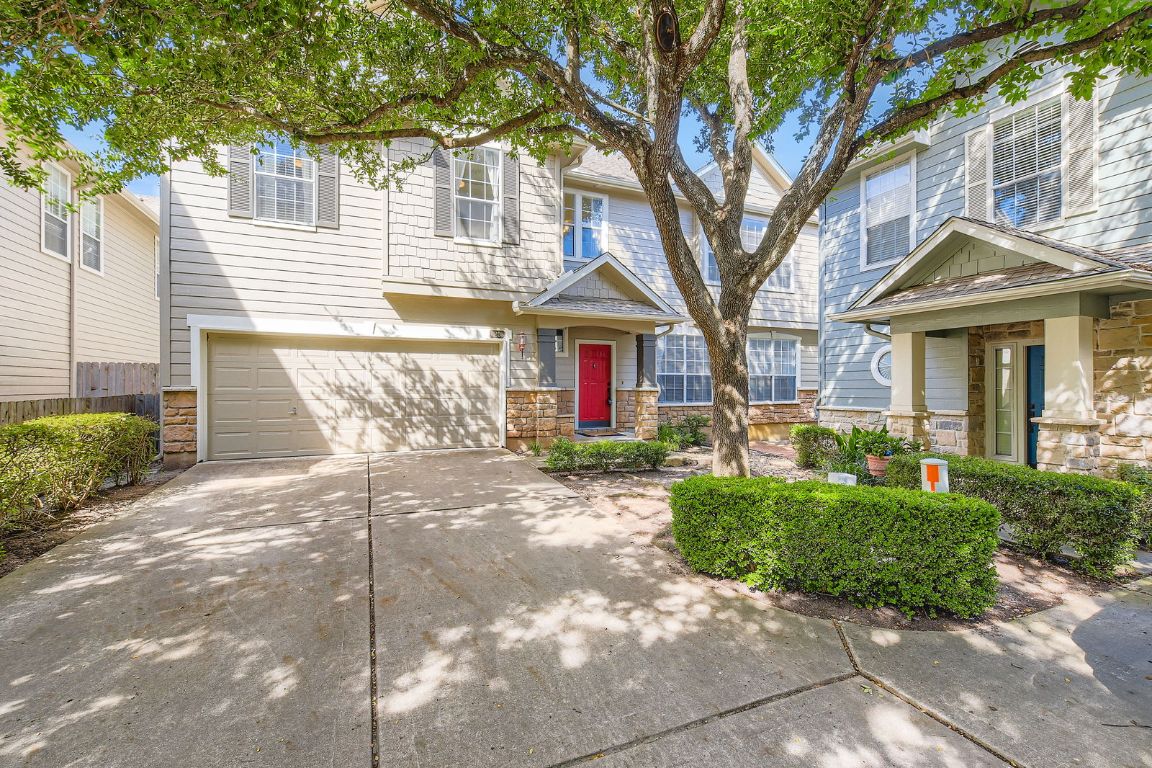 8518 Cahill Drive, Unit 20 Austin, TX 78729 - Photo 3 of 36 a front view of a house with garden