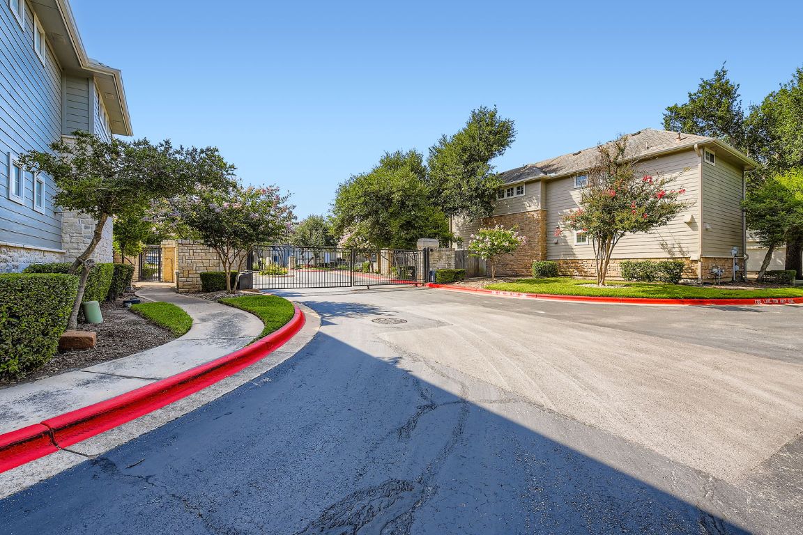 8518 Cahill Drive, Unit 20 Austin, TX 78729 - Photo 33 of 36 a view of outdoor space yard and swimming pool