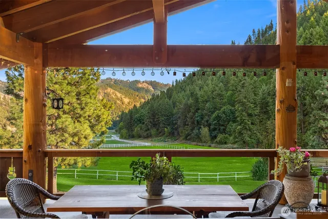 a large bedroom with bed and large windows