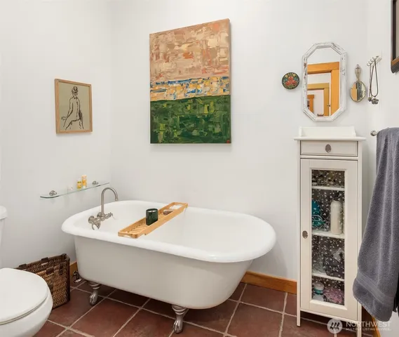 a living room with furniture a rug and a chandelier