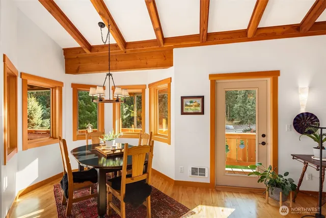 a living room with lots of furniture and a chandelier