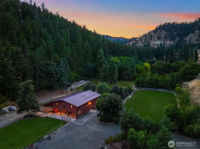 an aerial view of a house with a yard