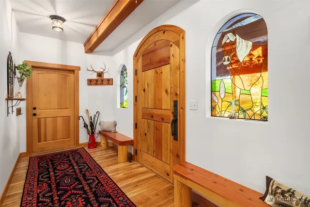 a view of a living room and a large window