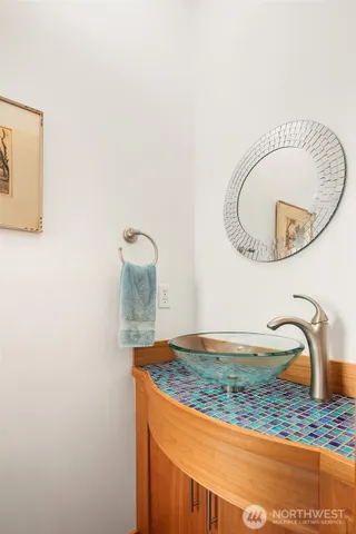 a living room with furniture a fireplace and decor