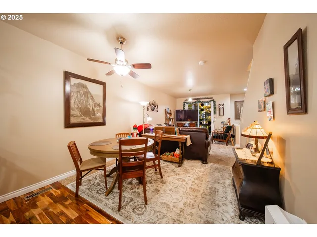 a view of a living room and kitchen