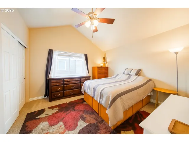 a bathroom with a sink vanity mirror and toilet