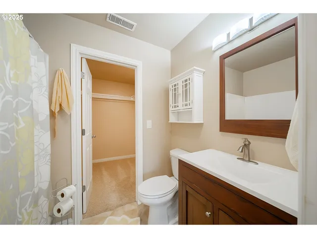 a view of a house with a flower garden