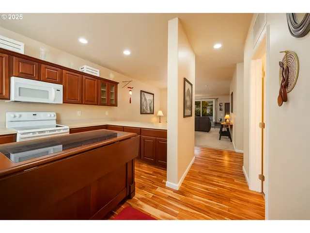 a living room with furniture a dining table and a piano