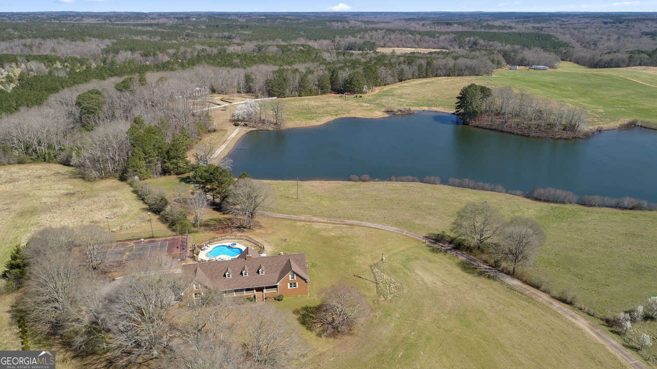 2940 East Lake Road McDonough, GA 30252 - Photo 1 of 47 an aerial view of a house with a lake view