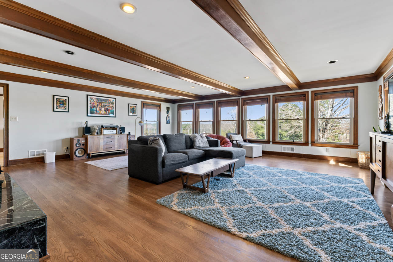 2940 East Lake Road McDonough, GA 30252 - Photo 12 of 47 a living room with furniture and a large window