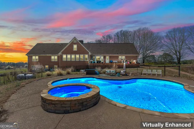 a view of swimming pool with outdoor seating and a potted plants