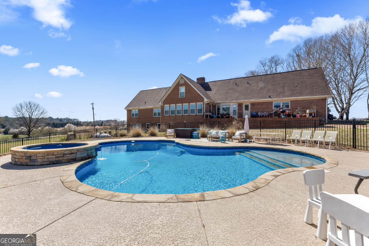 2940 East Lake Road McDonough, GA 30252 - Photo 40 of 47 a view of a swimming pool and lounge chairs