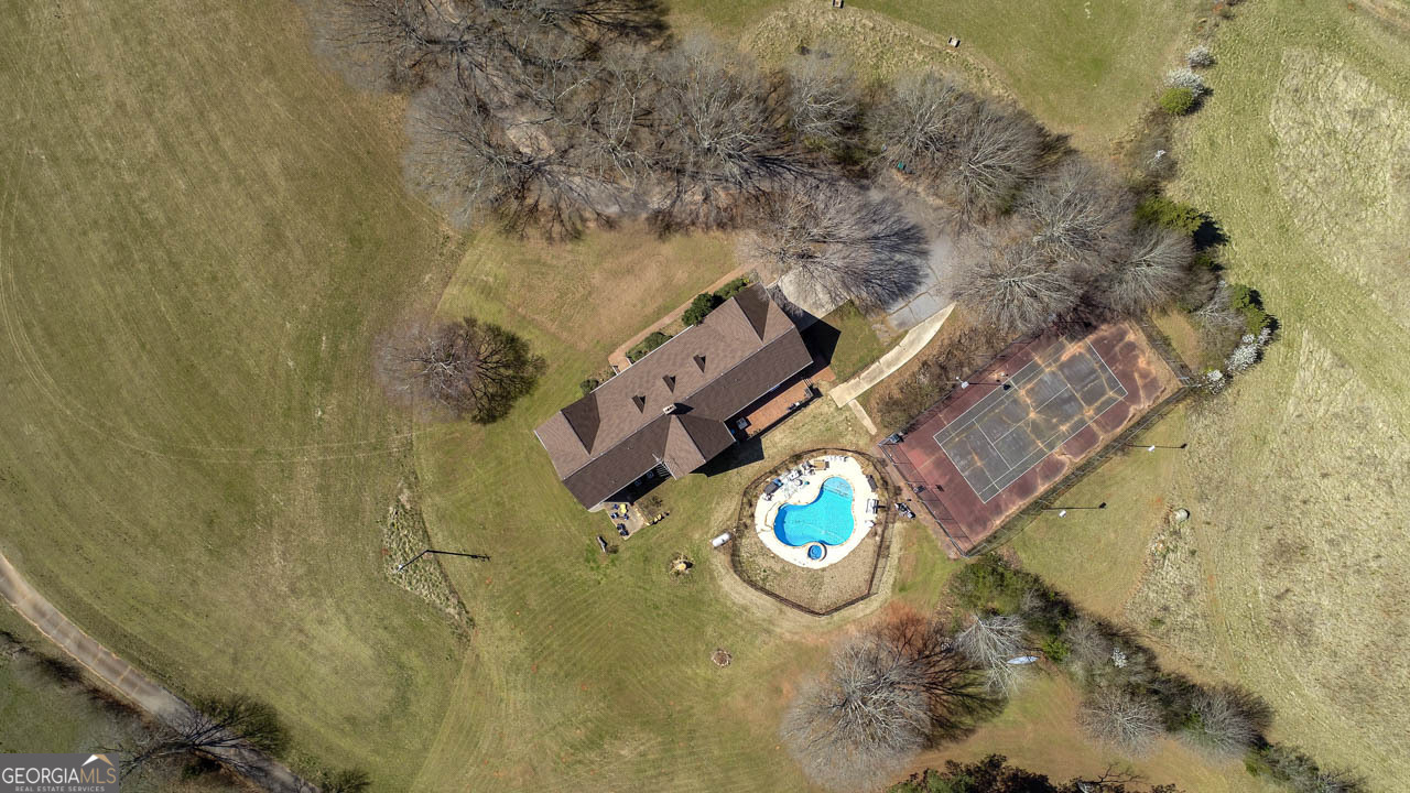 2940 East Lake Road McDonough, GA 30252 - Photo 5 of 47 view of a house with a backyard