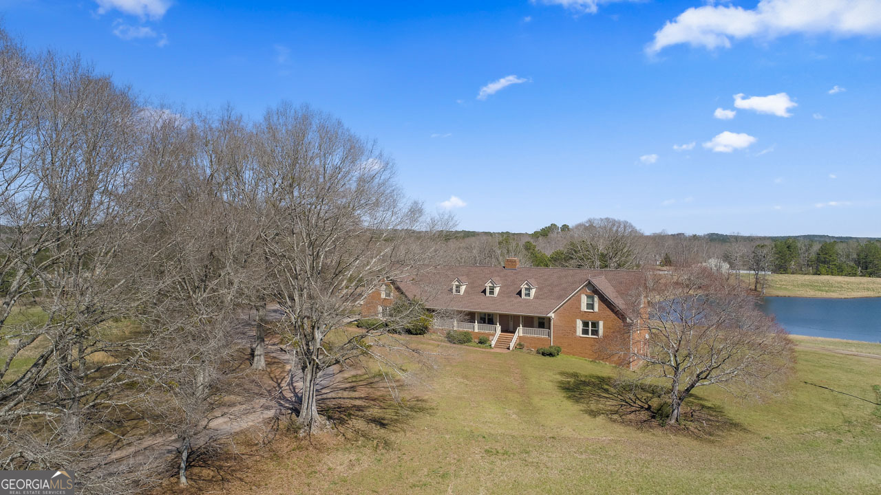 2940 East Lake Road McDonough, GA 30252 - Photo 6 of 47 a view of a lake with a mountain in the background